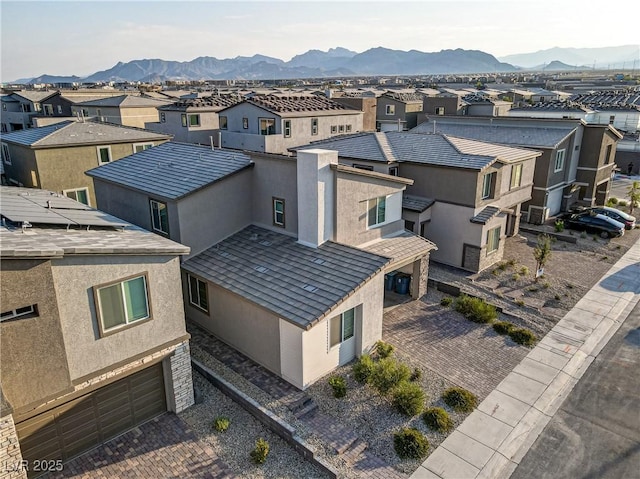 birds eye view of property with a mountain view