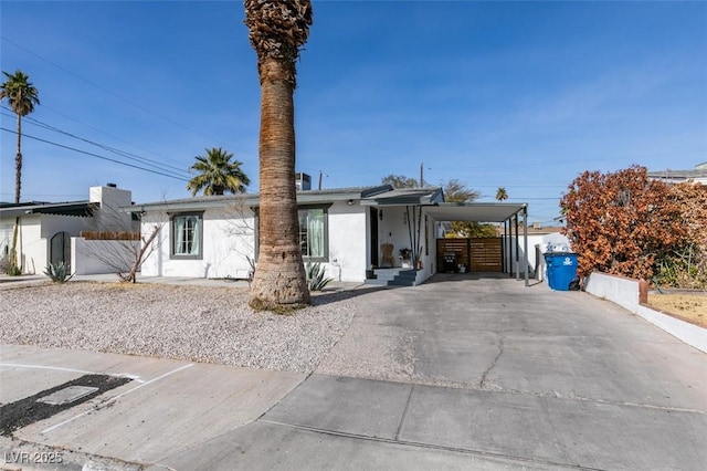 view of front of property with a carport