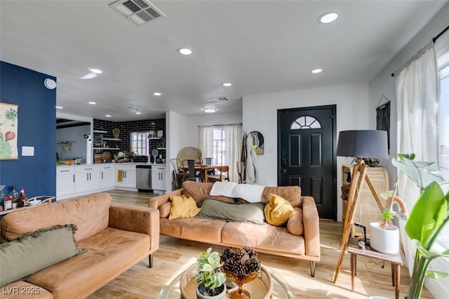 living room with light hardwood / wood-style flooring