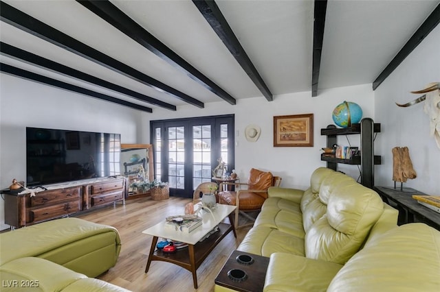 living room featuring french doors, beam ceiling, and light hardwood / wood-style flooring