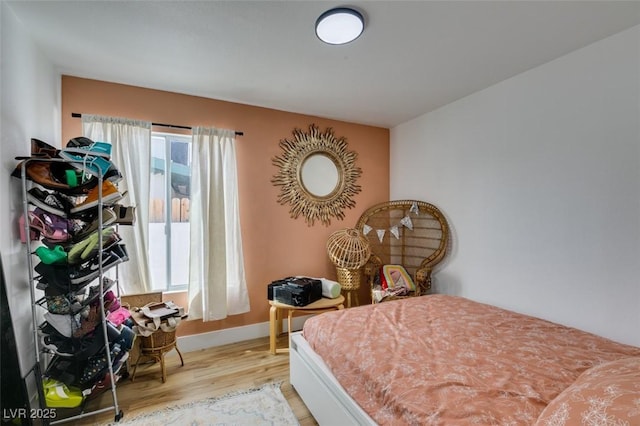 bedroom with light wood-type flooring