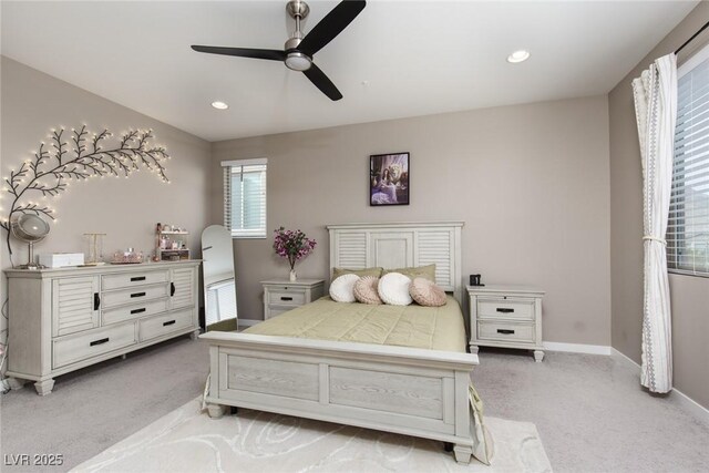 bedroom with light colored carpet and ceiling fan