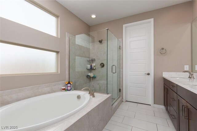 full bath with tile patterned floors, a shower stall, a bath, and vanity