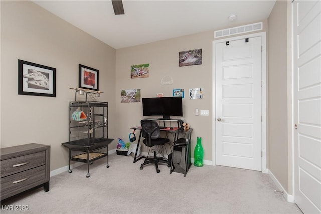 carpeted home office with baseboards, visible vents, and a ceiling fan