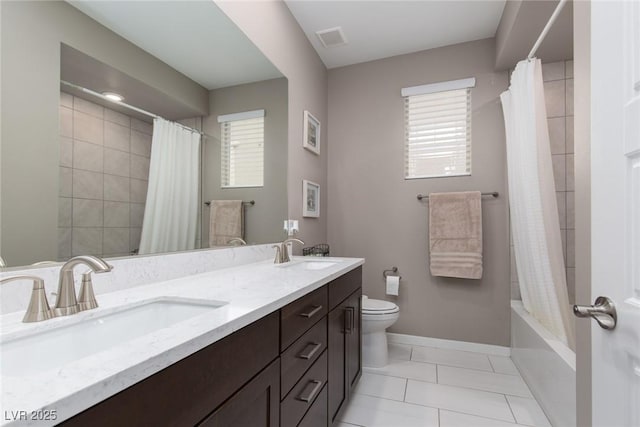 bathroom with toilet, baseboards, visible vents, and a sink