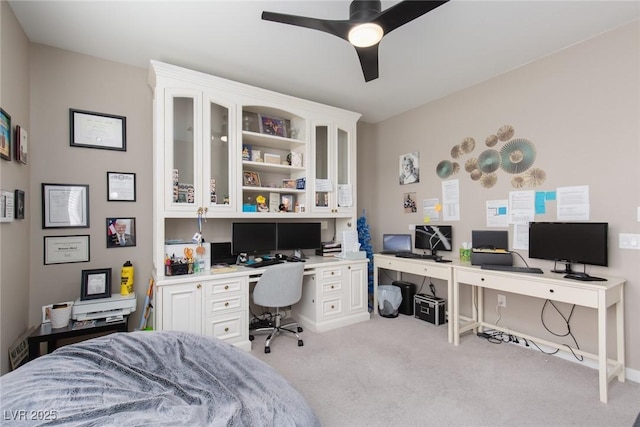 bedroom with light carpet and a ceiling fan