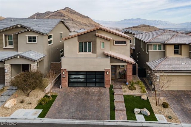 view of front of home featuring a garage and a mountain view