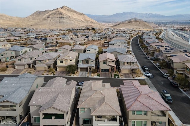 drone / aerial view featuring a mountain view and a residential view