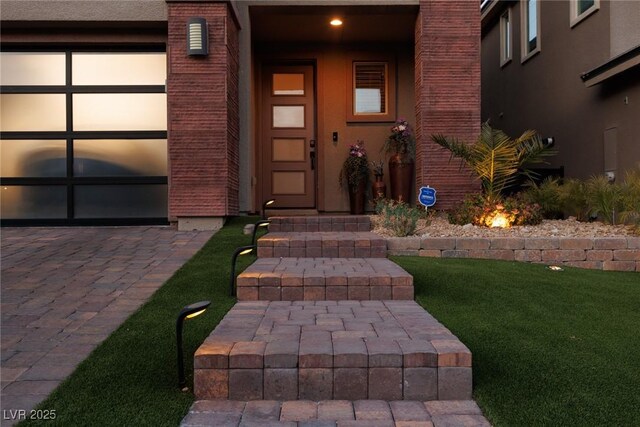 view of exterior entry with stucco siding