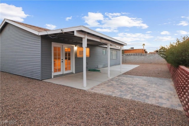 rear view of property featuring a patio and french doors