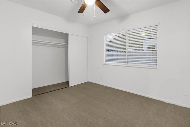 unfurnished bedroom with carpet, ceiling fan, and a closet