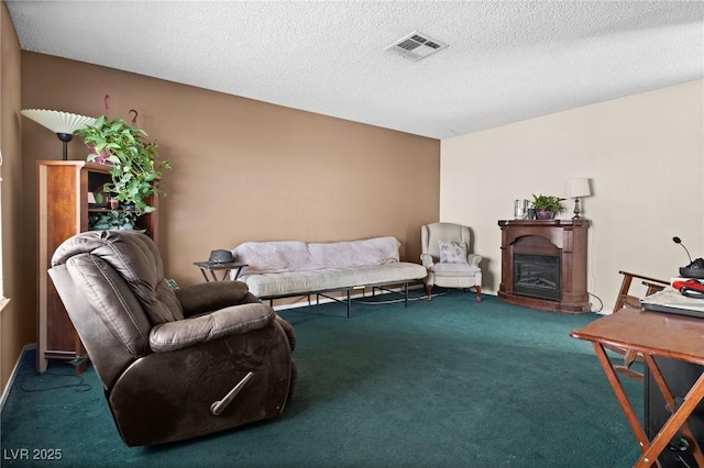 living room with carpet and a textured ceiling