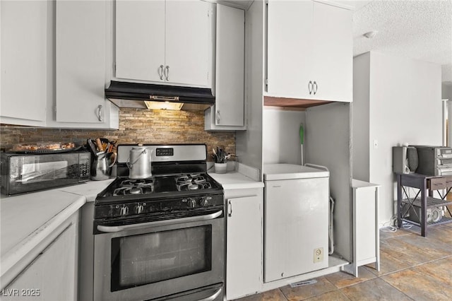 kitchen featuring white cabinetry, gas stove, and tasteful backsplash