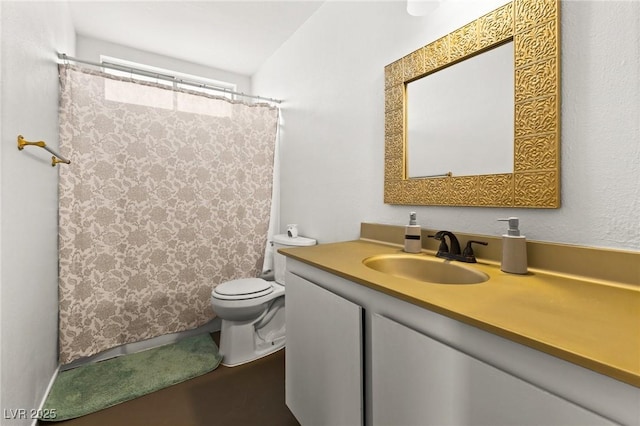 bathroom featuring vanity, a shower with curtain, and toilet