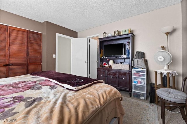 carpeted bedroom with a closet and a textured ceiling