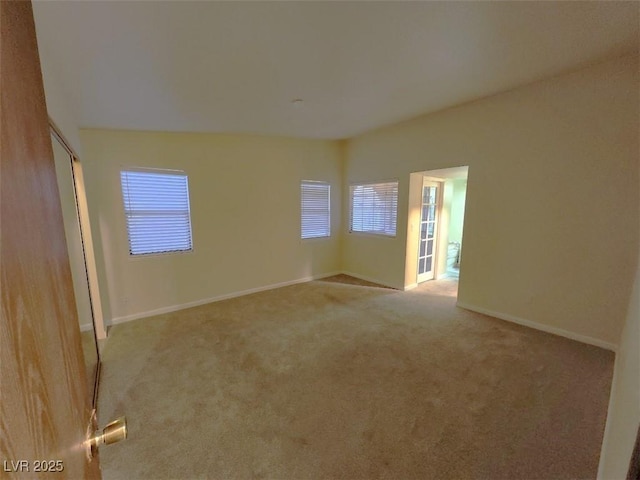 empty room featuring light colored carpet