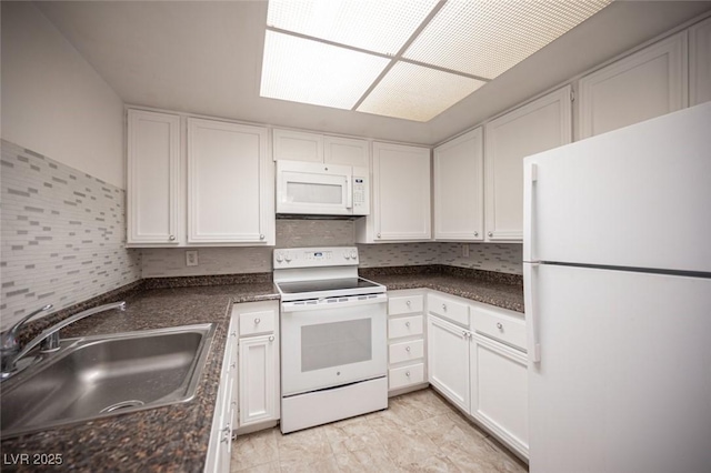 1701 E Katie Ave Unit 65, Las Vegas, NV 89119 - kitchen with white appliances, a sink, white cabinetry, and dark countertops