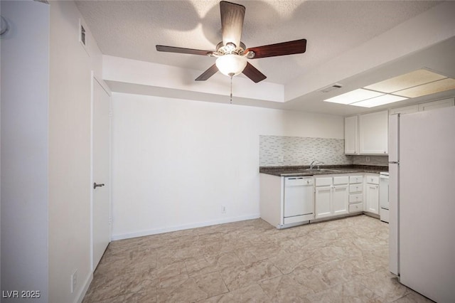 1701 E Katie Ave Unit 65, Las Vegas, NV 89119 - kitchen featuring white appliances, dark countertops, a ceiling fan, white cabinets, and a sink