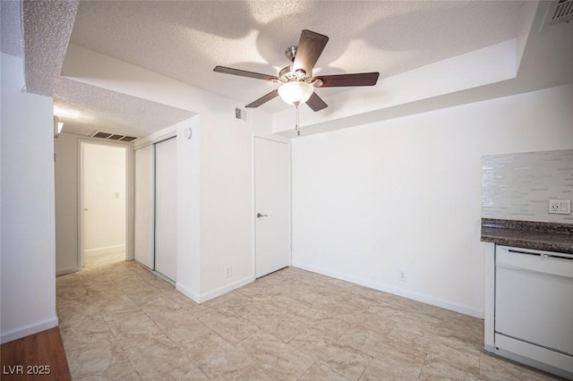 1701 E Katie Ave Unit 65, Las Vegas, NV 89119 - spare room with a textured ceiling, ceiling fan, and baseboards