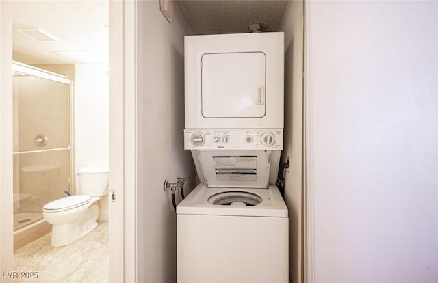 1701 E Katie Ave Unit 65, Las Vegas, NV 89119 - laundry area with stacked washing machine and dryer