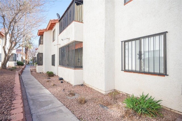 1701 E Katie Ave Unit 65, Las Vegas, NV 89119 - view of side of home with stucco siding