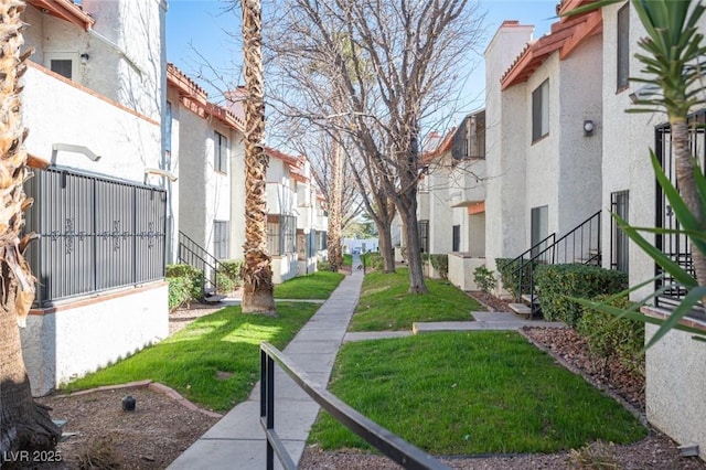 1701 E Katie Ave Unit 65, Las Vegas, NV 89119 - surrounding community featuring a residential view and a lawn