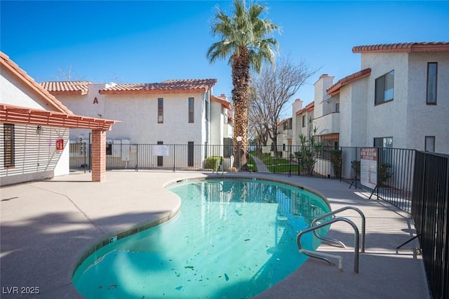 1701 E Katie Ave Unit 65, Las Vegas, NV 89119 - community pool with a residential view, a patio area, and a pergola