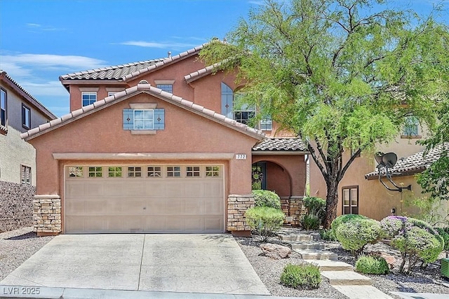 mediterranean / spanish house with a garage