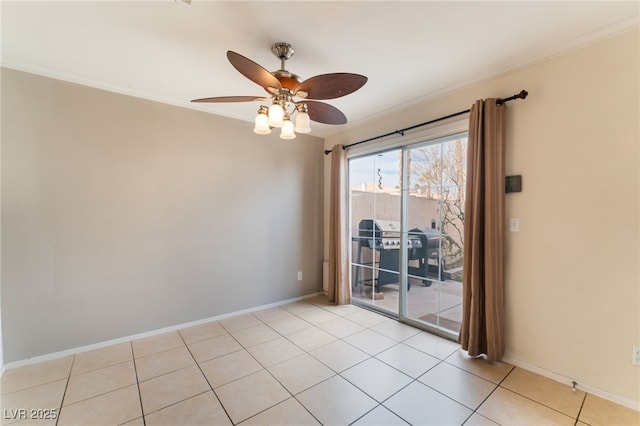 tiled spare room with crown molding and ceiling fan