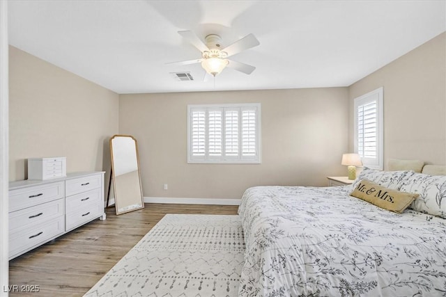 bedroom featuring hardwood / wood-style floors and ceiling fan