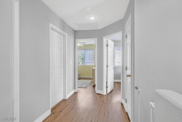 corridor featuring light hardwood / wood-style flooring