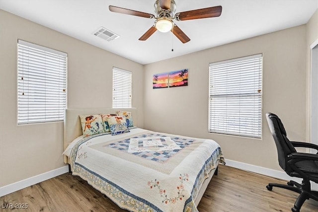 bedroom featuring hardwood / wood-style floors and ceiling fan