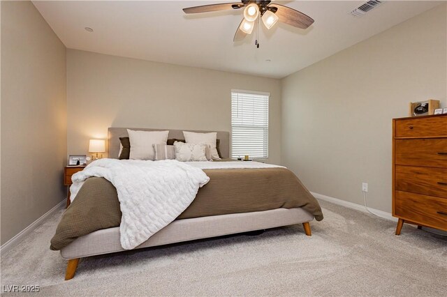 bedroom with a ceiling fan, light colored carpet, visible vents, and baseboards