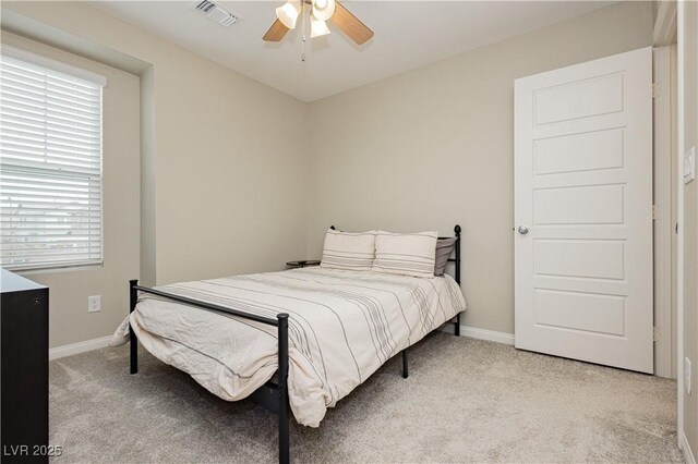 carpeted bedroom featuring ceiling fan