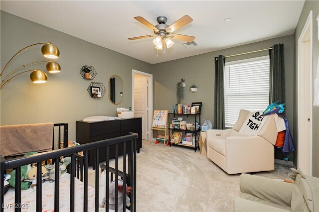 bedroom with visible vents and light colored carpet