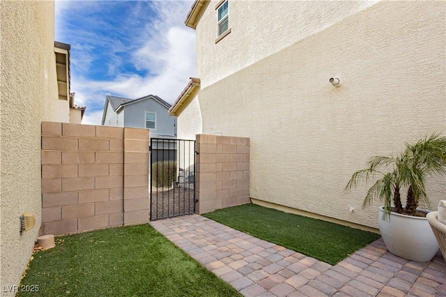 view of yard featuring a gate and fence