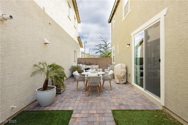 view of patio / terrace featuring outdoor dining area and a fenced backyard