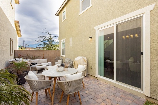 view of patio / terrace with an outdoor hangout area and fence