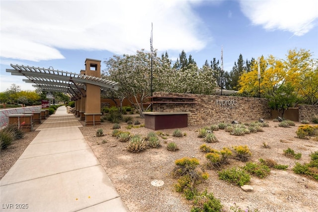 view of front of home with a pergola