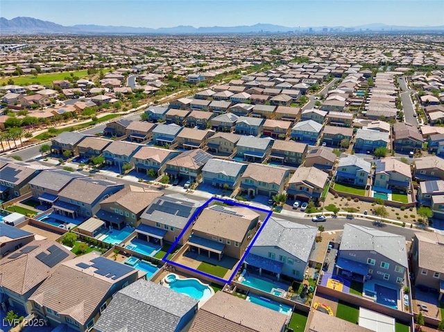 birds eye view of property featuring a mountain view