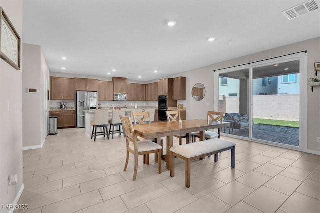 dining room with light tile patterned floors