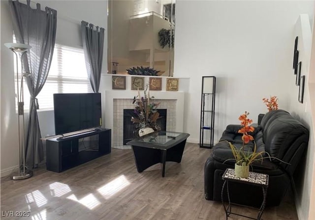 6250 W Flamingo Rd Unit 88, Las Vegas, NV 89103 - living room with hardwood / wood-style flooring and a tile fireplace