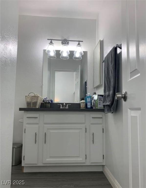 6250 W Flamingo Rd Unit 88, Las Vegas, NV 89103 - bathroom featuring vanity and wood-type flooring