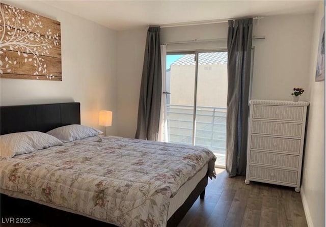 6250 W Flamingo Rd Unit 88, Las Vegas, NV 89103 - bedroom featuring dark hardwood / wood-style floors and access to outside
