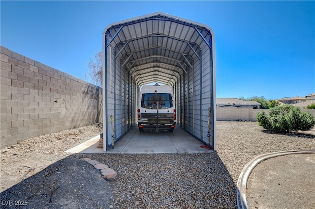 view of parking / parking lot featuring a carport