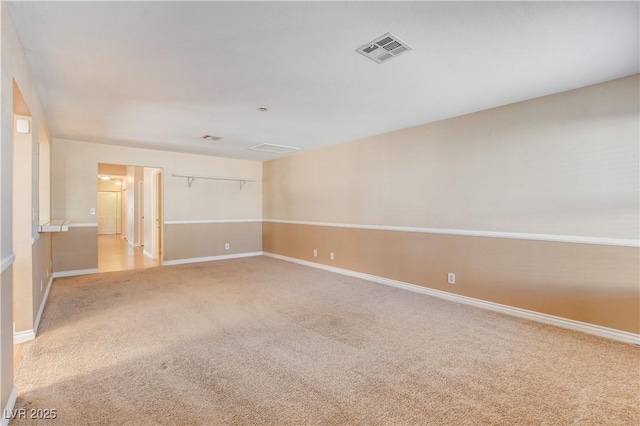 spare room with light colored carpet