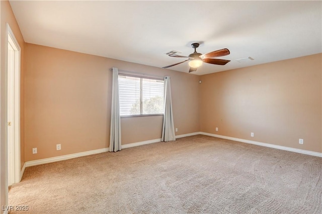 empty room with light carpet and ceiling fan