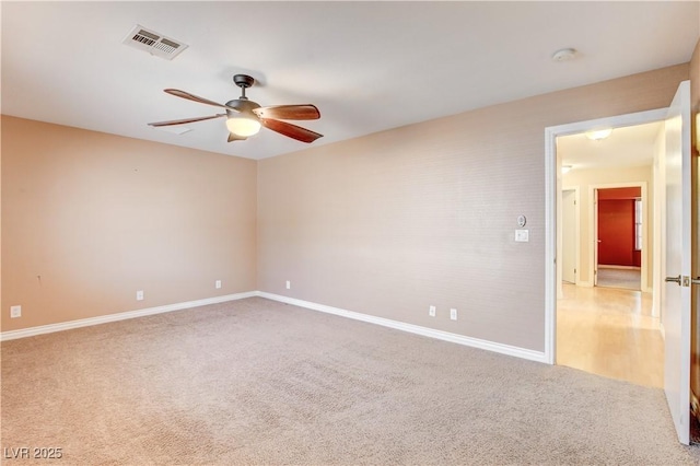 unfurnished room with carpet and ceiling fan