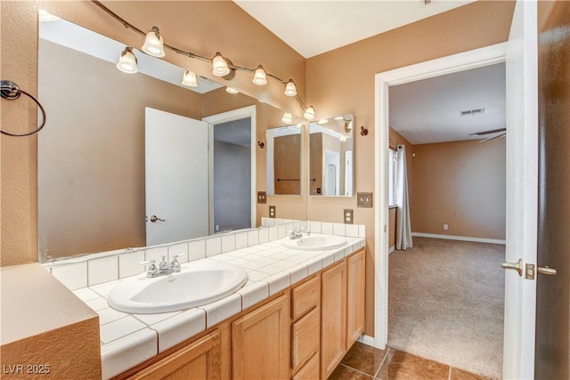 bathroom with vanity and tile patterned flooring