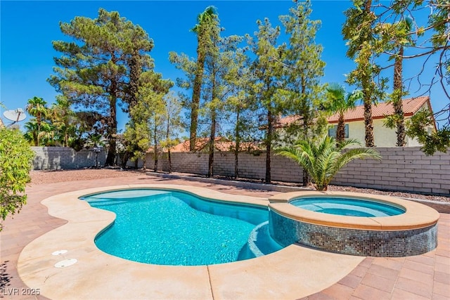 view of swimming pool featuring an in ground hot tub and a patio